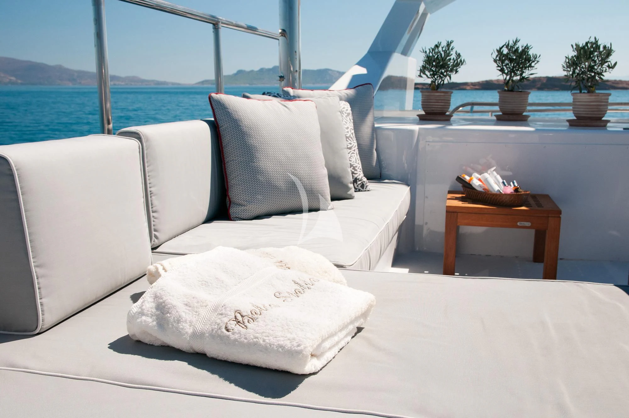 a couch with pillows on it aboard BELLA STELLA Yacht for Charter