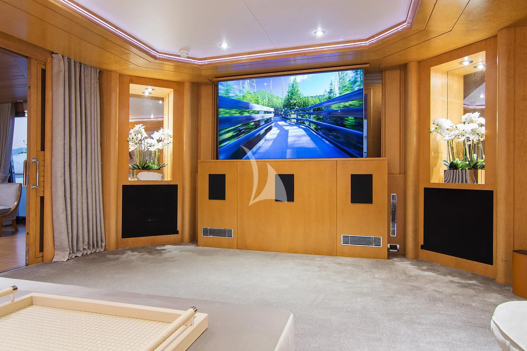 a room with a tv and a bed aboard BELLA STELLA Yacht for Charter