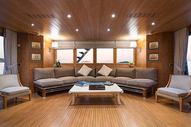 a living room with a couch and a coffee table aboard BELLA STELLA Yacht for Charter