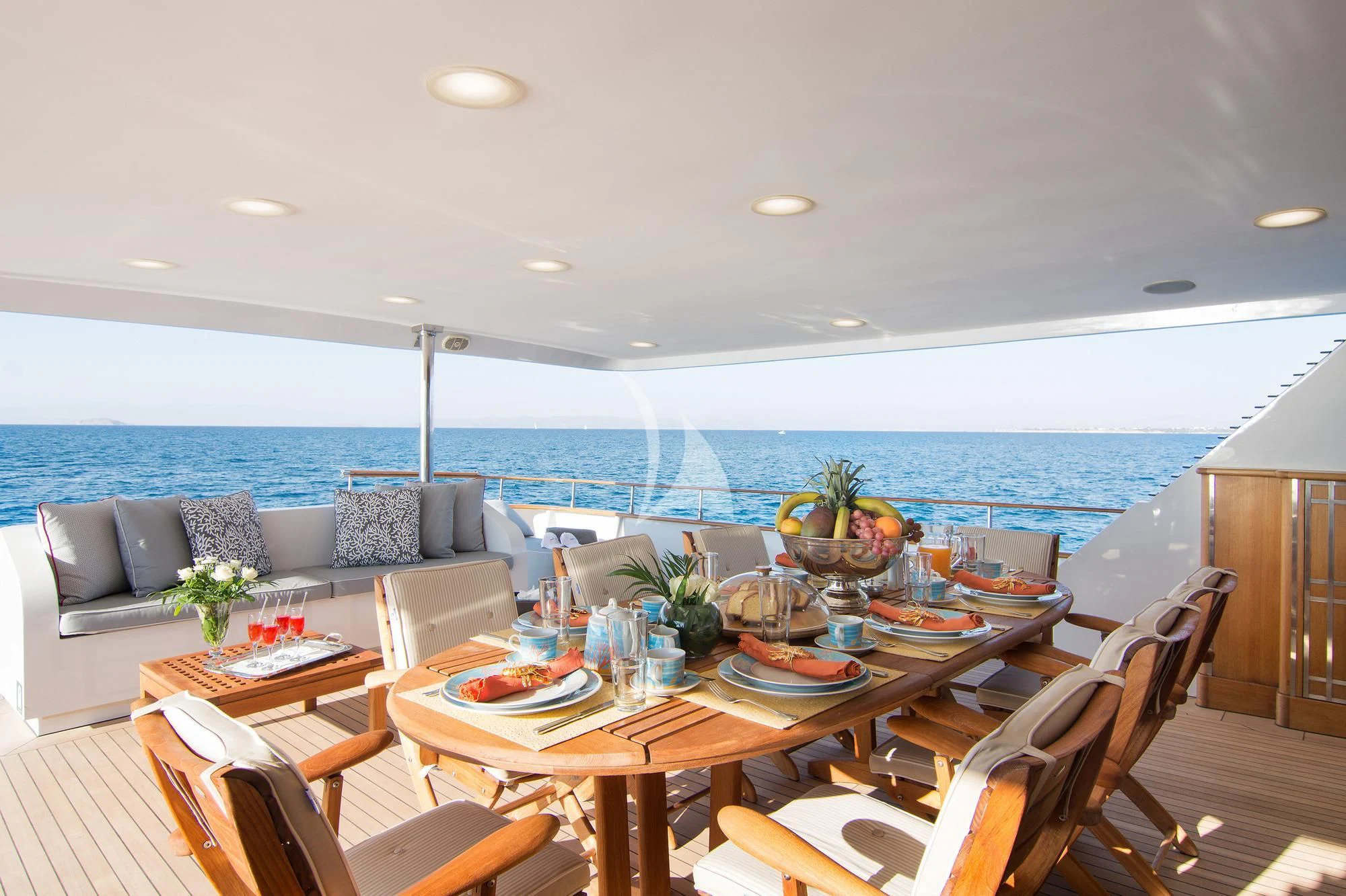 a dining room with a large ocean view aboard BELLA STELLA Yacht for Charter