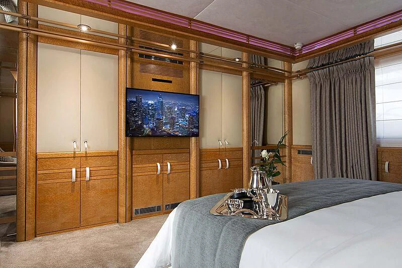 a bedroom with a bed and cabinets aboard BELLA STELLA Yacht for Charter