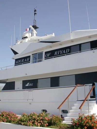 a white boat with a sign on it aboard BELLA STELLA Yacht for Charter