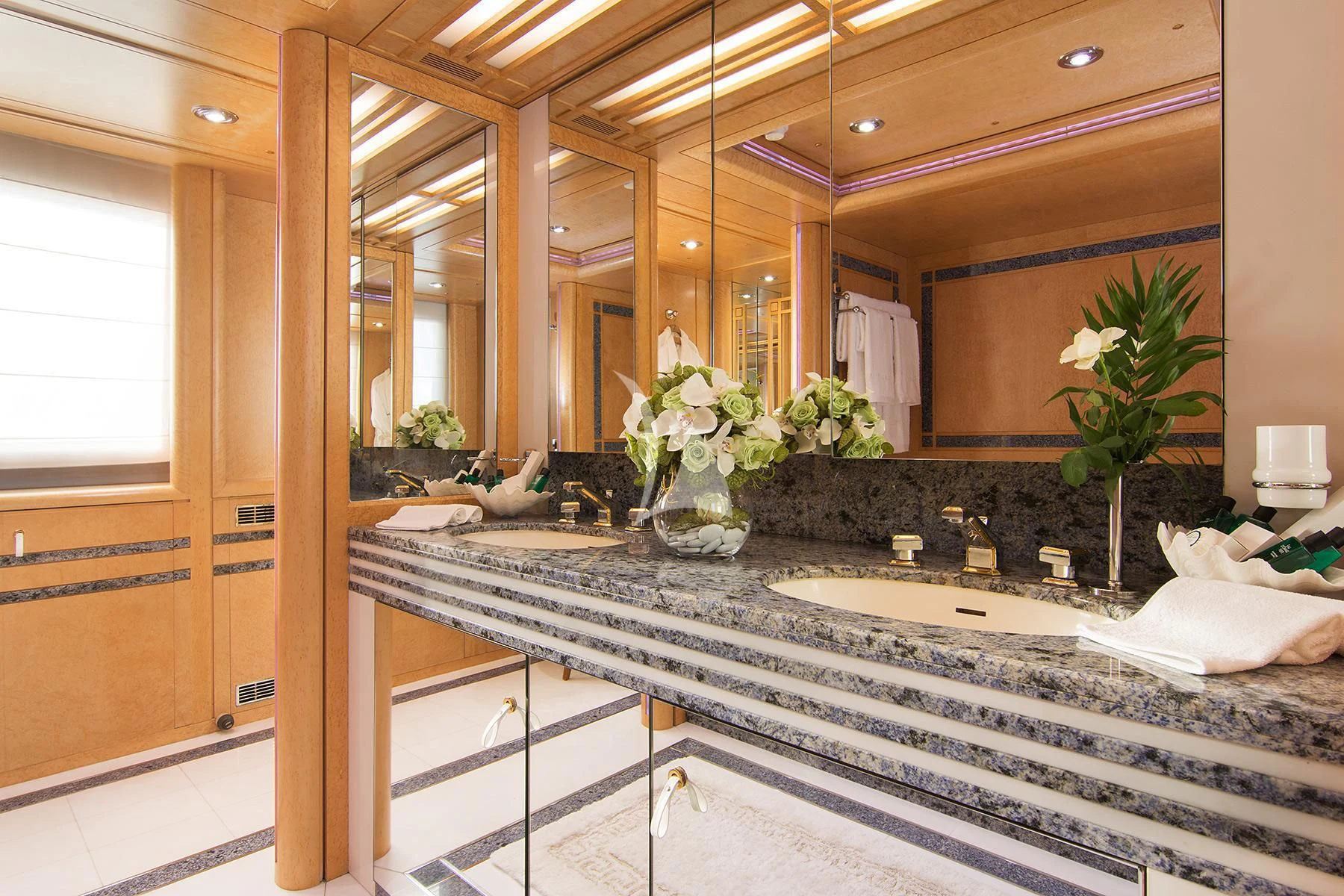 a bathroom with a large mirror aboard BELLA STELLA Yacht for Charter
