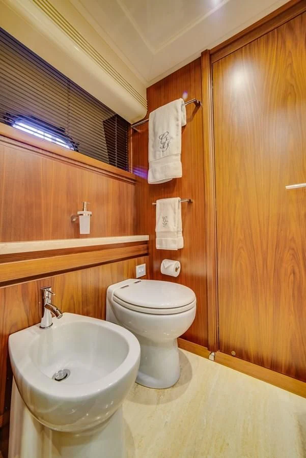 a bathroom with a toilet and sink aboard ALEGRA Yacht for Sale