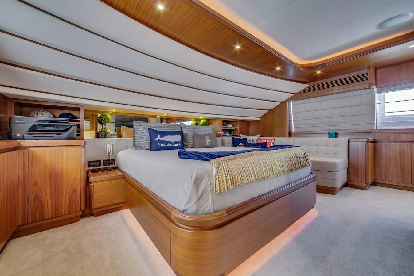 a bedroom with a bed and a desk aboard ALEGRA Yacht for Sale