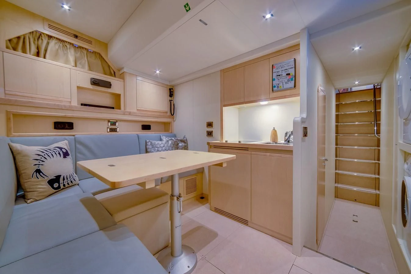 a room with a bed and a table aboard ALEGRA Yacht for Sale