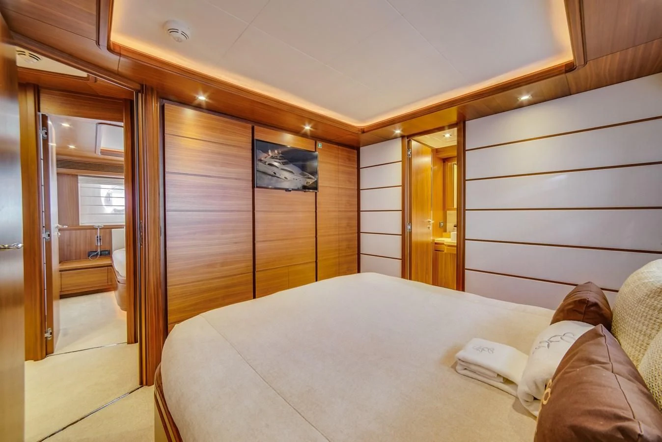 a person lying in a bed aboard ALEGRA Yacht for Sale