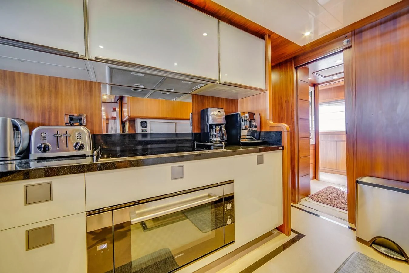 a kitchen with a stove and cabinets aboard ALEGRA Yacht for Sale