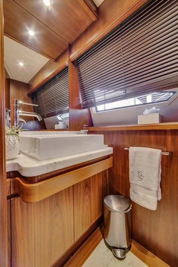 a bathroom with a sink and a mirror aboard ALEGRA Yacht for Sale