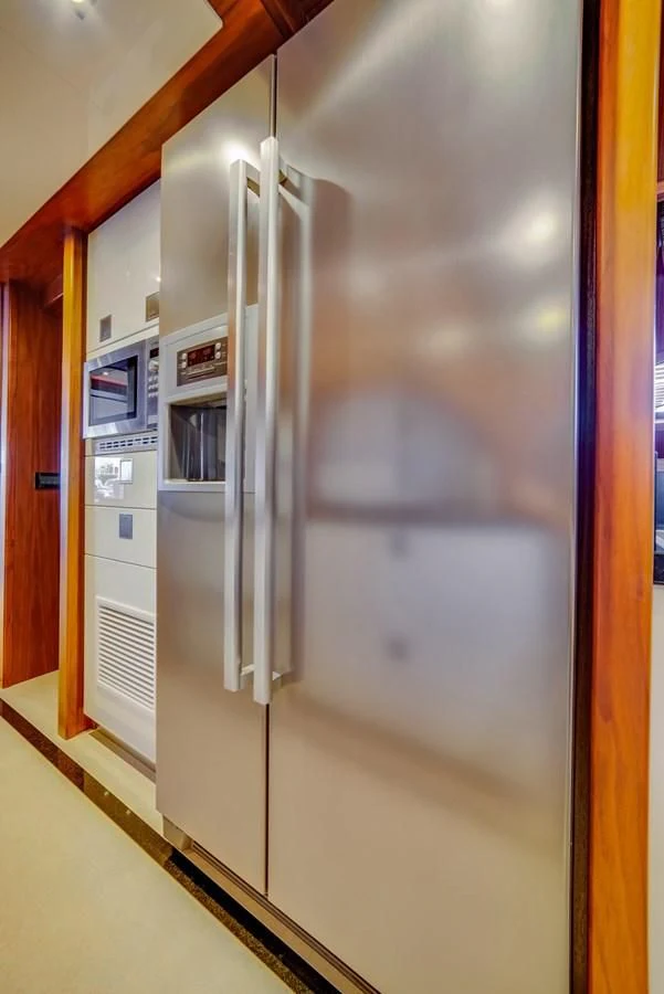 a refrigerator in a kitchen aboard ALEGRA Yacht for Sale
