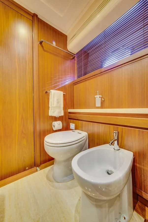 a bathroom with a toilet and sink aboard ALEGRA Yacht for Sale