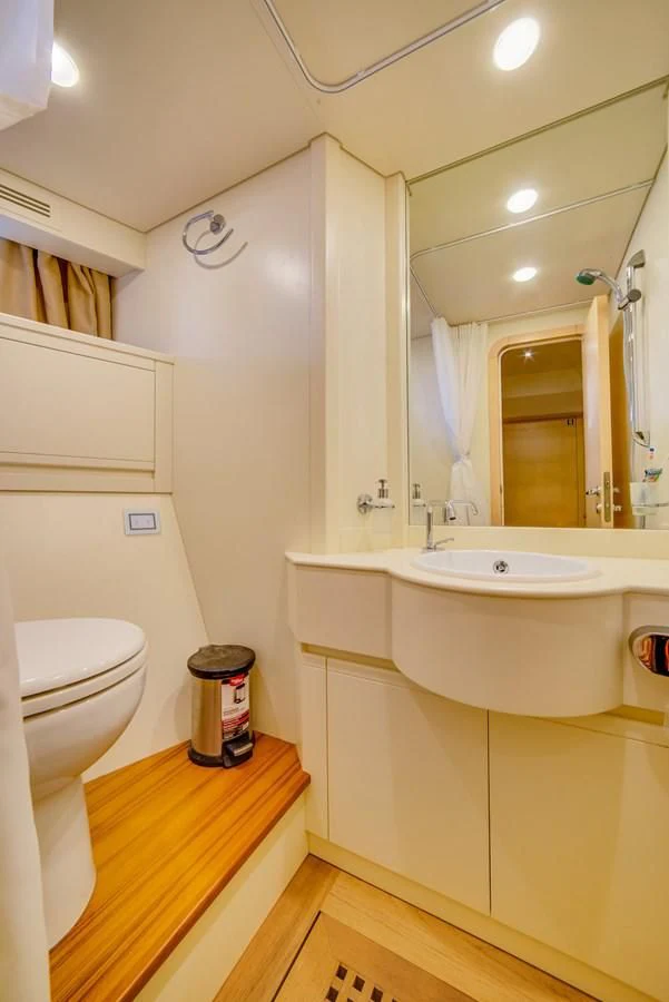 a bathroom with a sink toilet and bathtub aboard ALEGRA Yacht for Sale