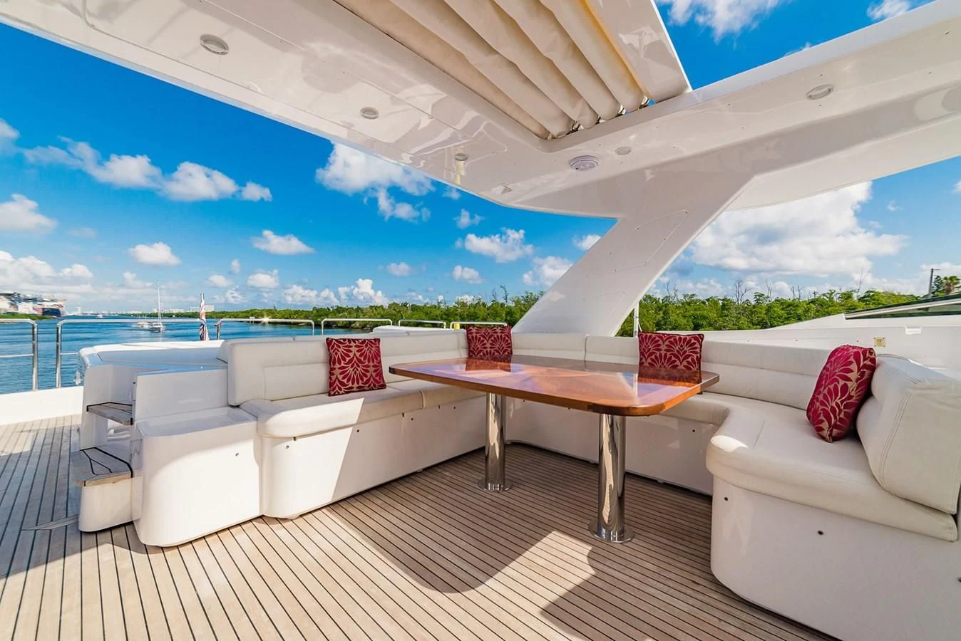 a room with a table and couches aboard ALEGRA Yacht for Sale