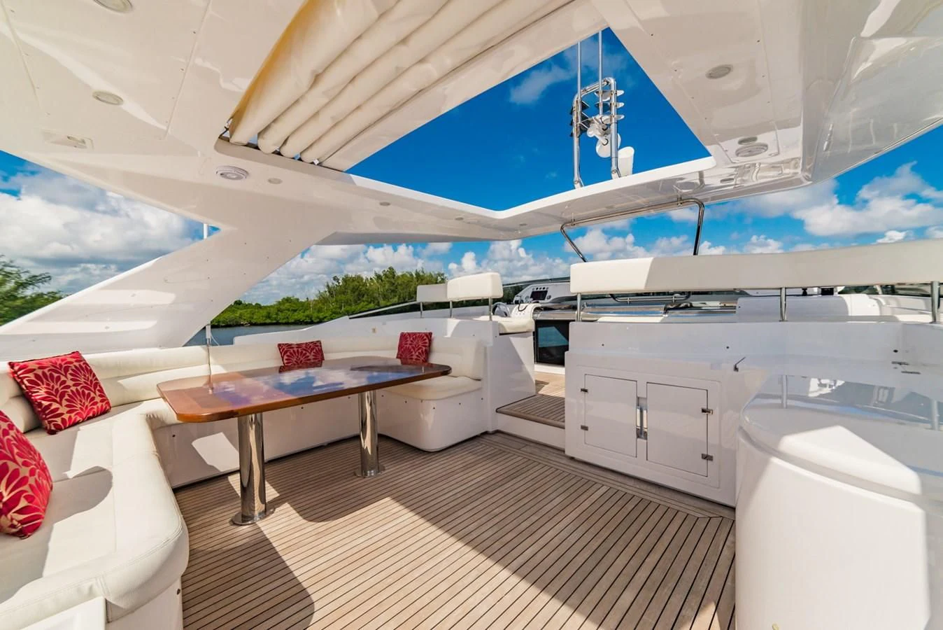 a room with a table and a couch aboard ALEGRA Yacht for Sale