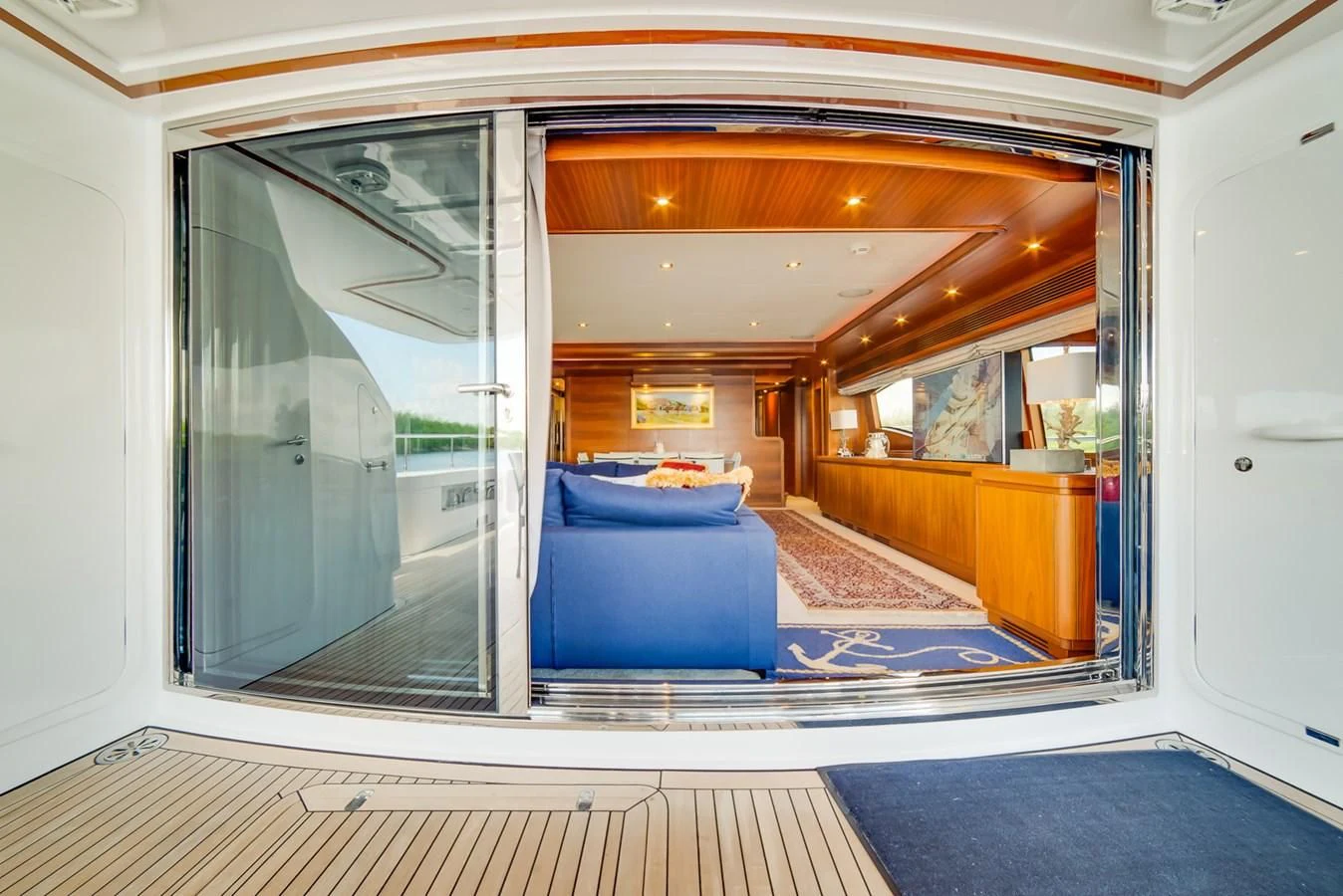 a room with a bed and a sliding glass door aboard ALEGRA Yacht for Sale