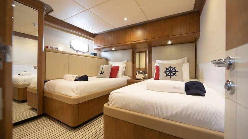 a room with two beds aboard PIPELINER Yacht for Sale