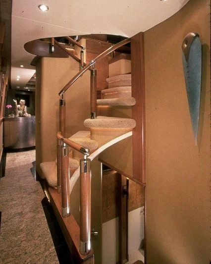 a bathroom with a sink and a large shelf with books on it aboard PIPELINER Yacht for Sale
