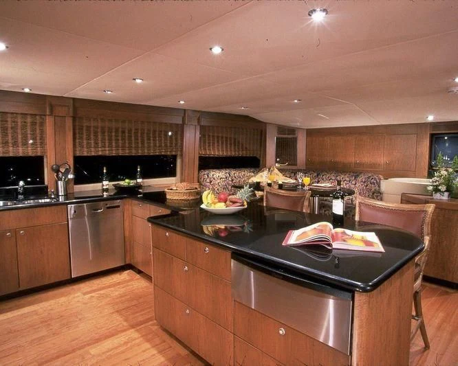 a kitchen with a large island aboard PIPELINER Yacht for Sale