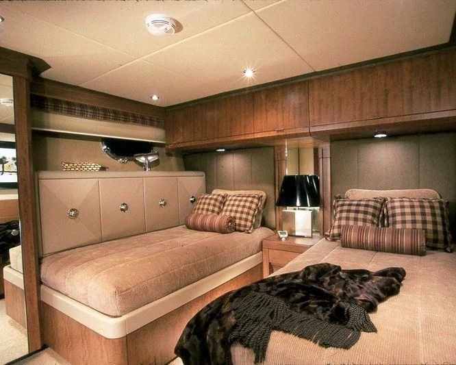 a bedroom with a bed and a dog aboard PIPELINER Yacht for Sale