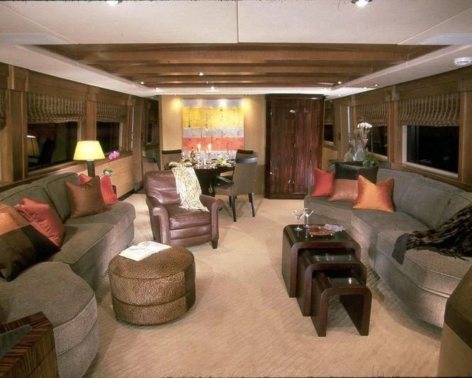 a living room with a couch and a table aboard PIPELINER Yacht for Sale