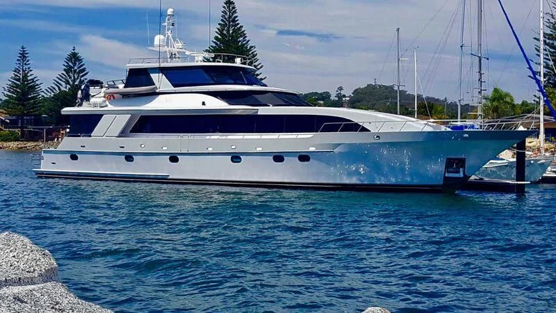 a white yacht in a body of water aboard PIPELINER Yacht for Sale