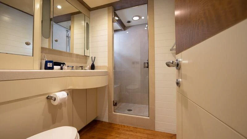 a bathroom with a glass shower aboard PIPELINER Yacht for Sale