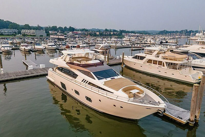 a group of boats are parked in a harbor aboard TEMPTATION Yacht for Sale