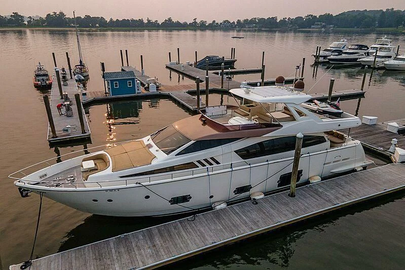 a boat docked at a pier aboard TEMPTATION Yacht for Sale