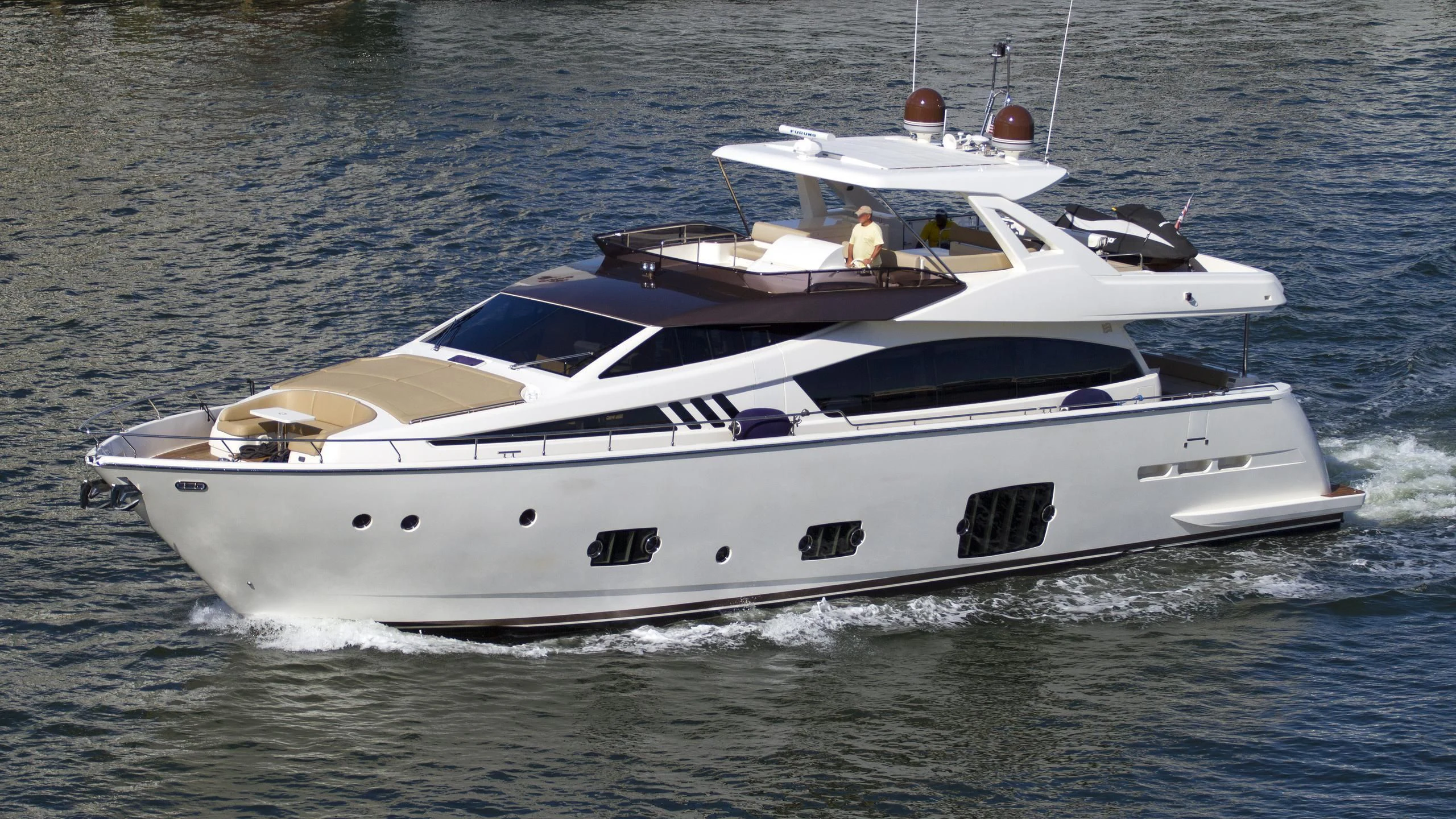a white yacht on the water aboard TEMPTATION Yacht for Sale