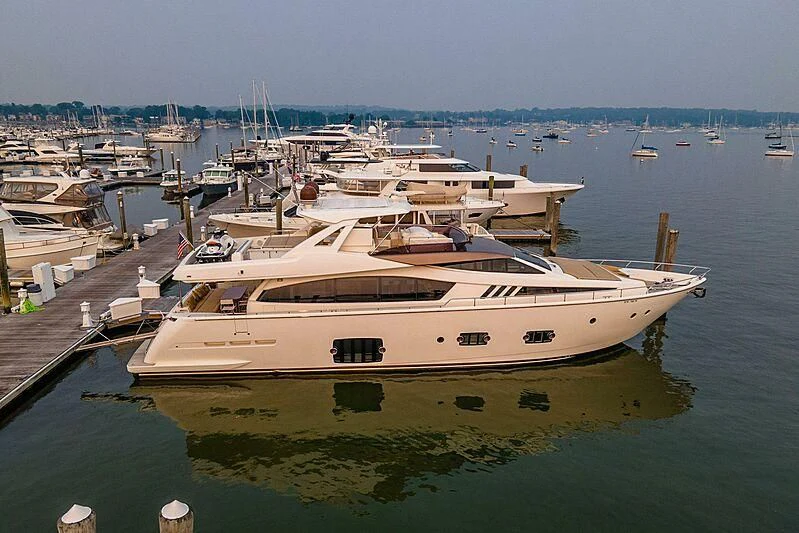 a large white yacht docked at a pier aboard TEMPTATION Yacht for Sale