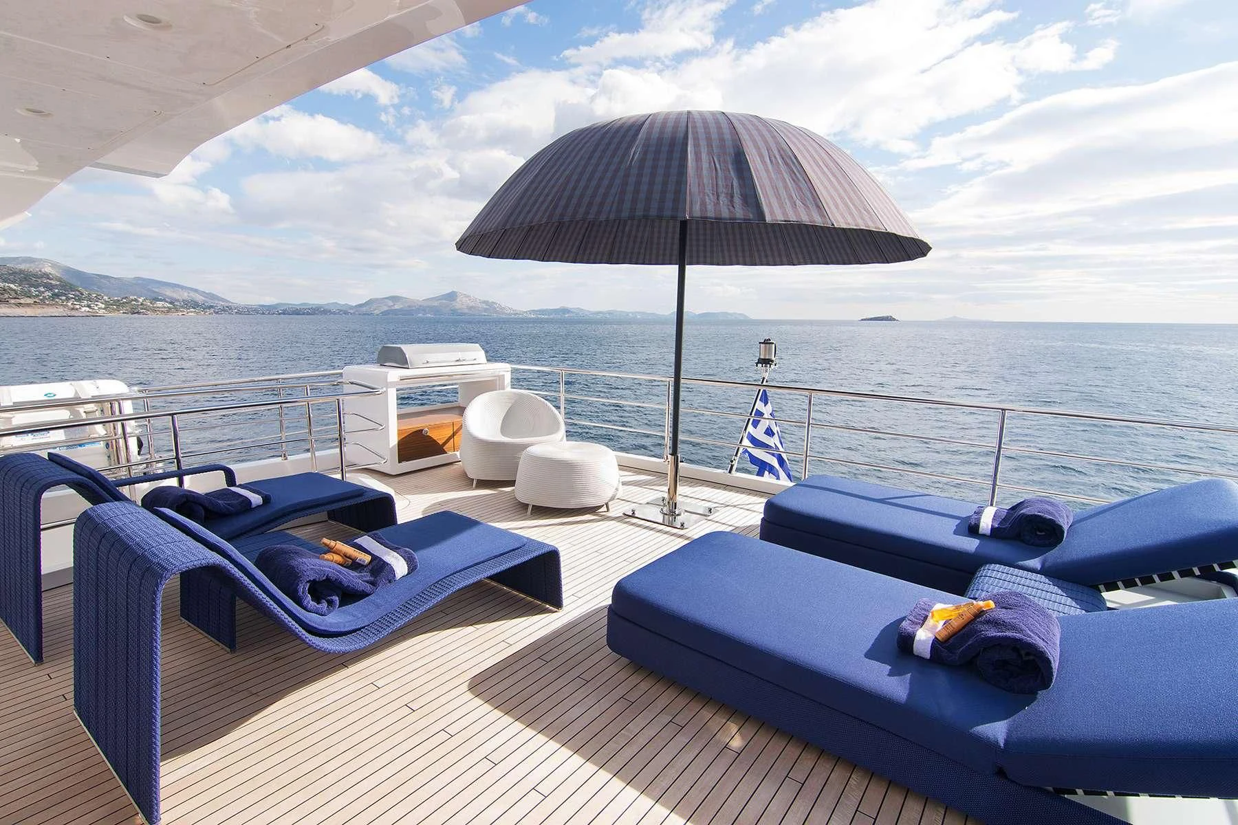 a boat with a umbrella on the deck aboard MEMORIES TOO Yacht for Sale