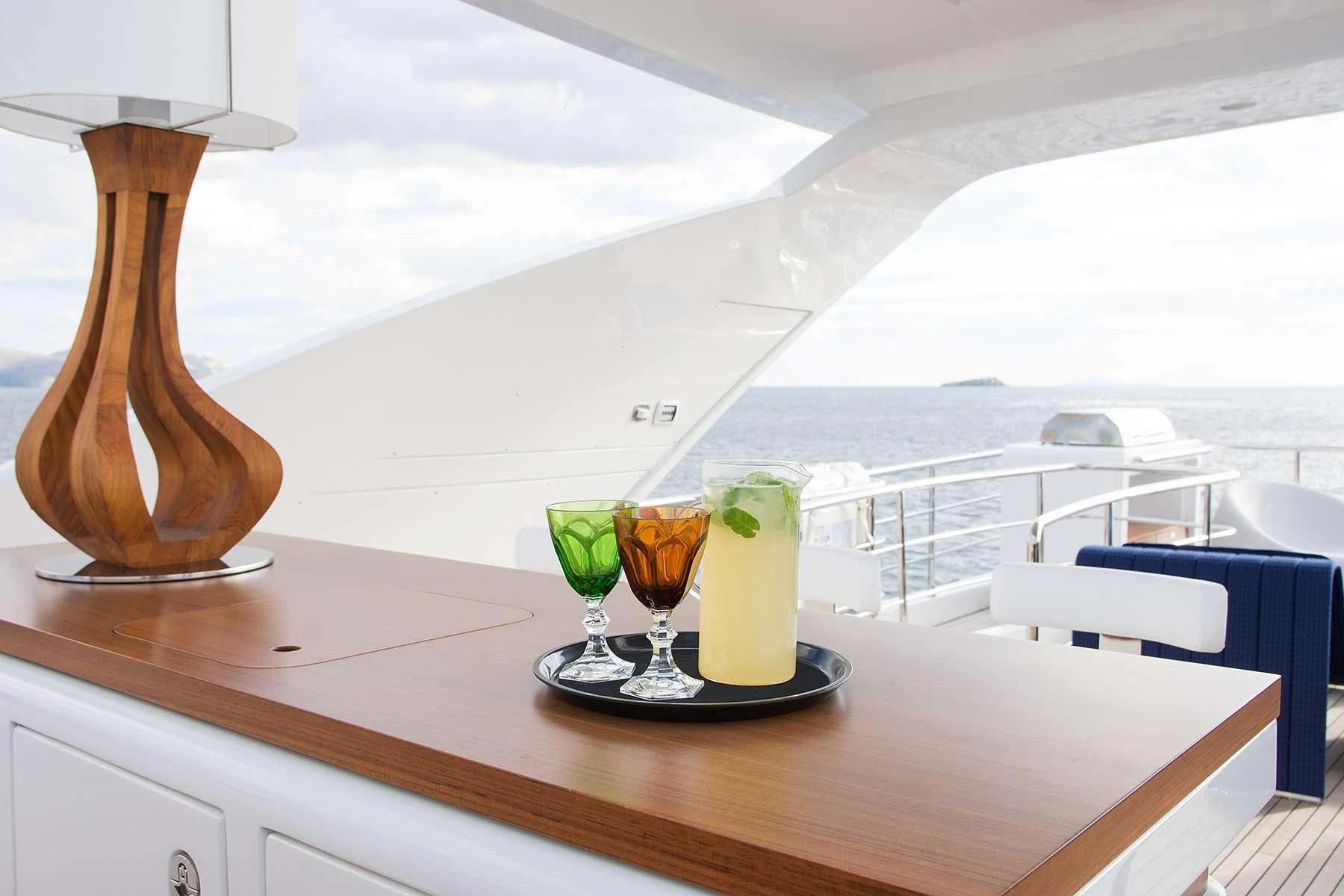 a group of glasses with drinks on a table aboard MEMORIES TOO Yacht for Sale