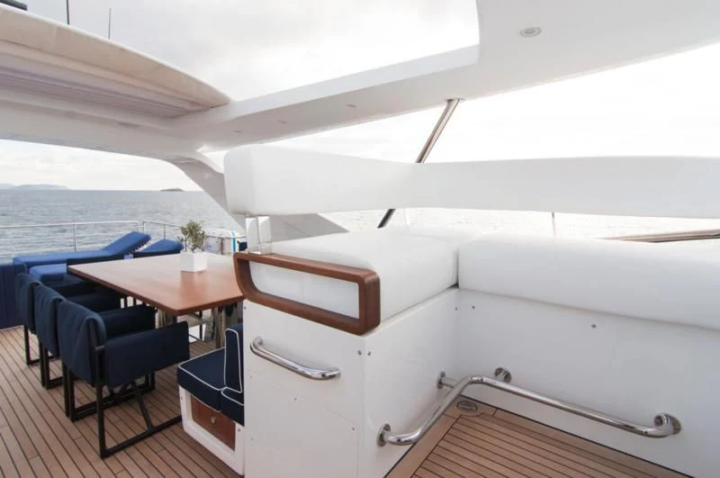 a room with a table and chairs aboard MEMORIES TOO Yacht for Sale