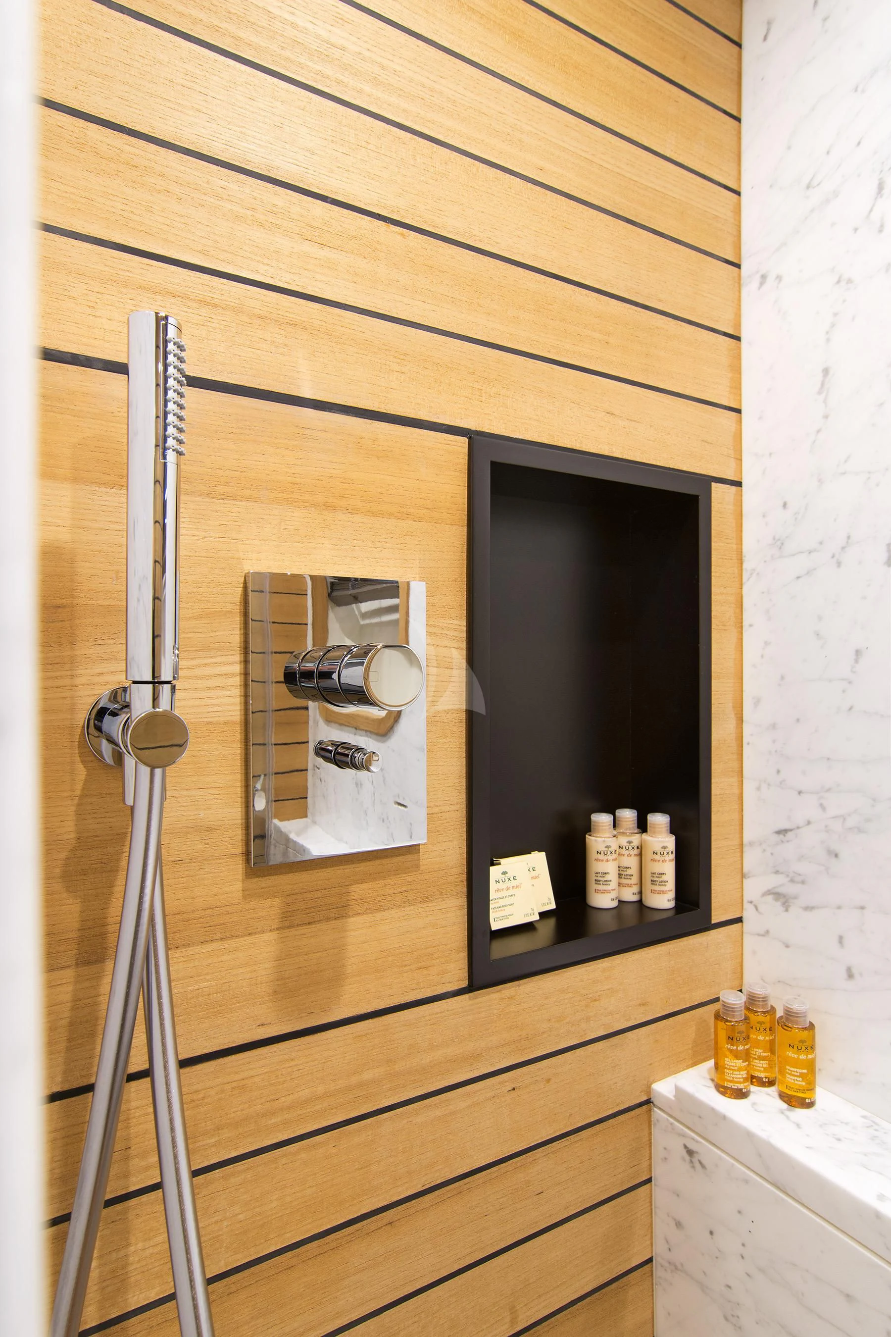 a wooden cabinet with a mirror and bottles on it aboard MEMORIES TOO Yacht for Sale