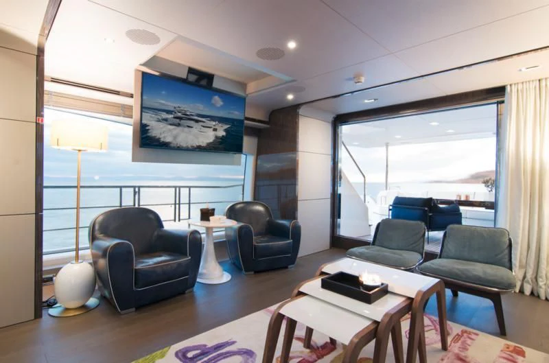 a living room with a large window aboard MEMORIES TOO Yacht for Sale