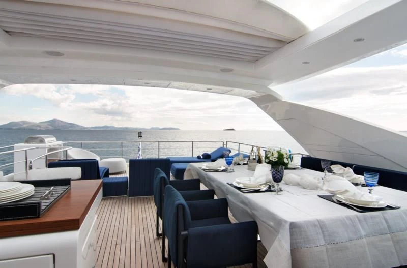 a room with a table and chairs aboard MEMORIES TOO Yacht for Sale