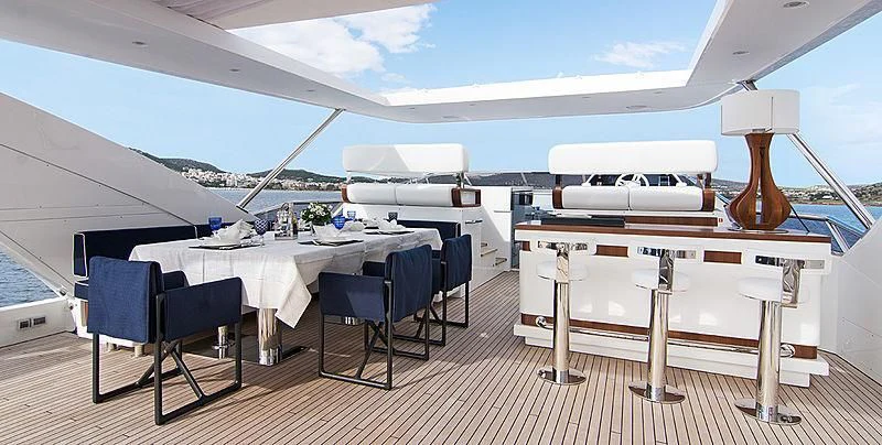 a large white tent with tables and chairs aboard MEMORIES TOO Yacht for Sale