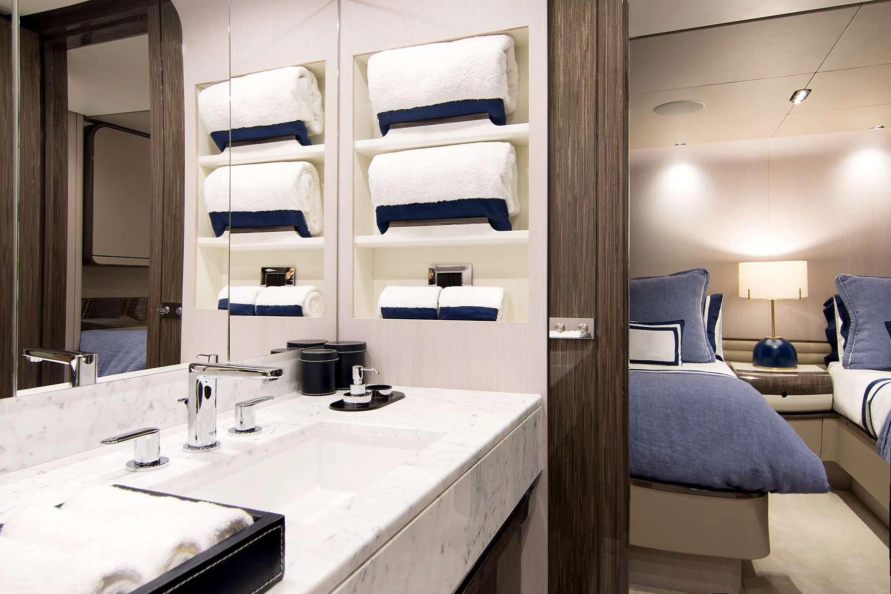 a bathroom with a sink and a bed aboard MEMORIES TOO Yacht for Sale