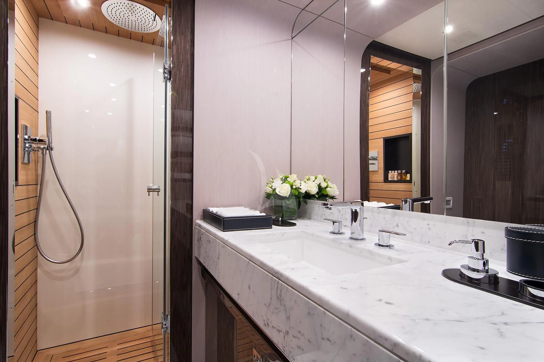 a bathroom with a large mirror aboard MEMORIES TOO Yacht for Sale