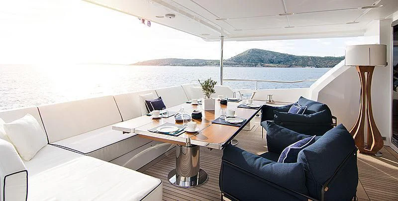 a room with a table and chairs aboard MEMORIES TOO Yacht for Sale