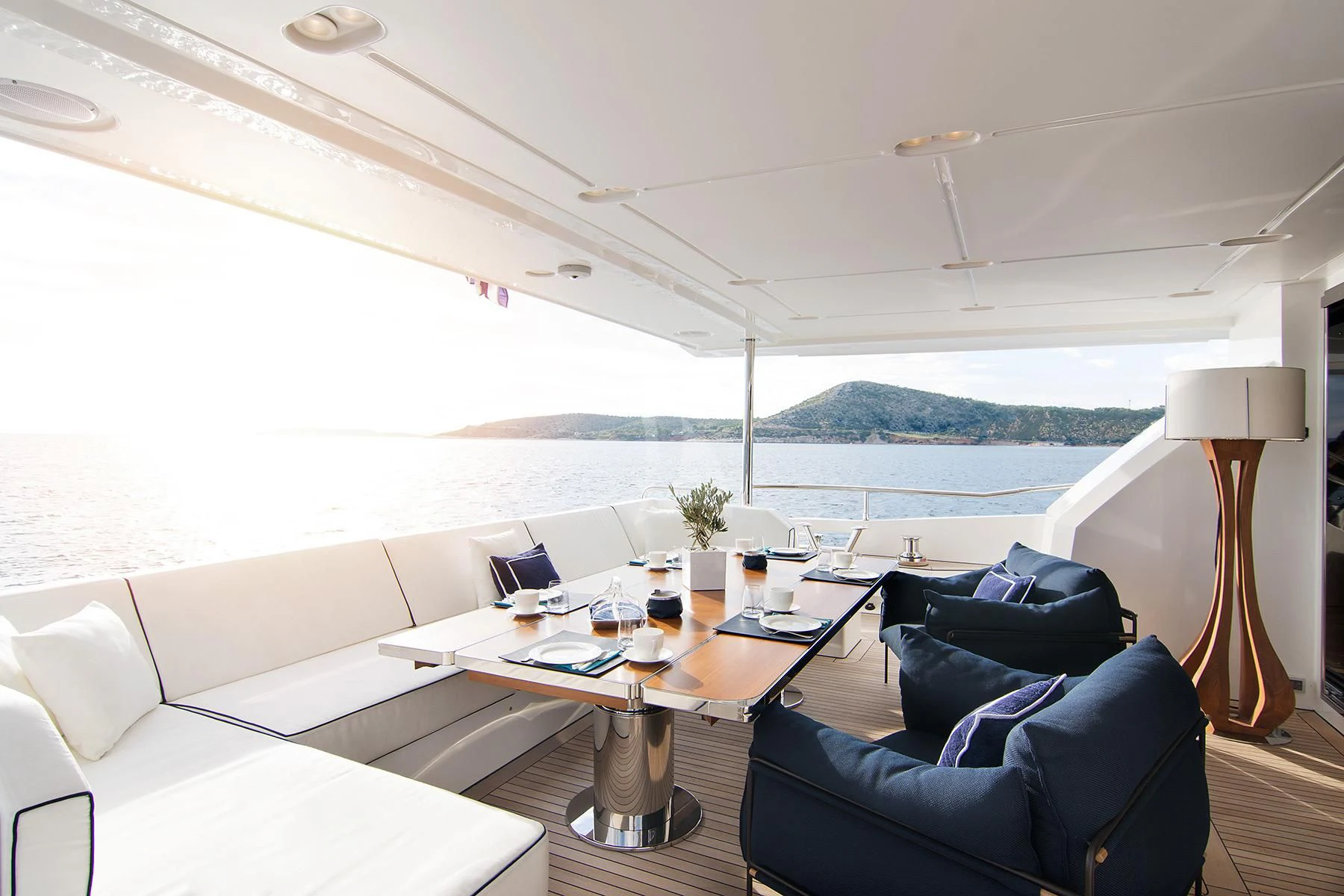 a room with a table chairs and a couch aboard MEMORIES TOO Yacht for Sale