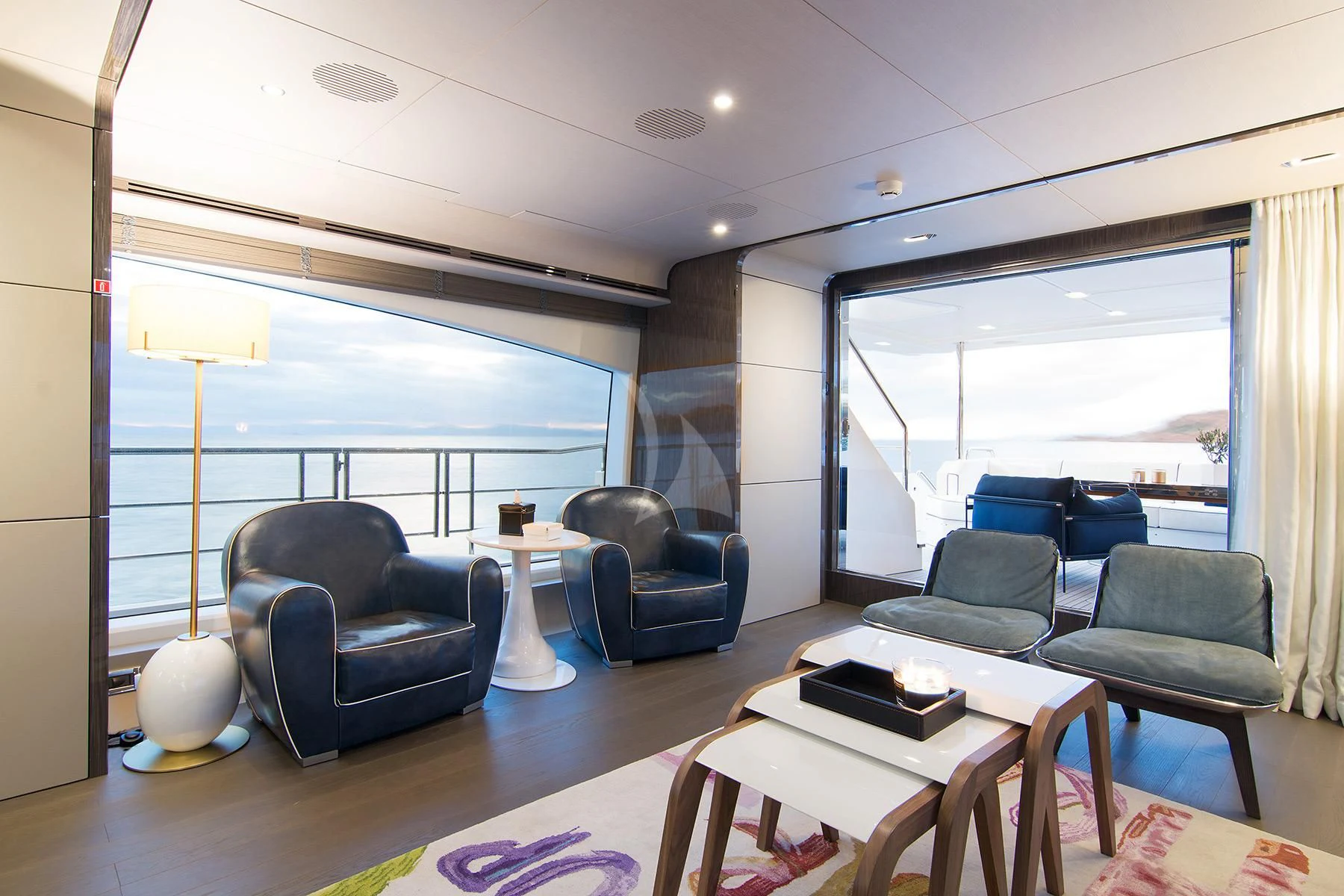 a living room with a large window aboard MEMORIES TOO Yacht for Sale