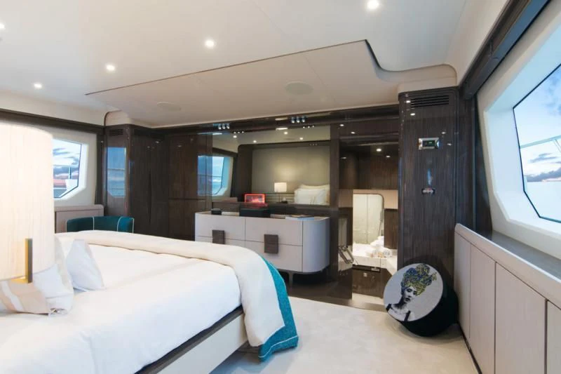 a room with a bed and a desk aboard MEMORIES TOO Yacht for Sale