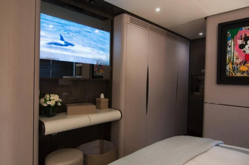 a room with a bed and a window aboard MEMORIES TOO Yacht for Sale