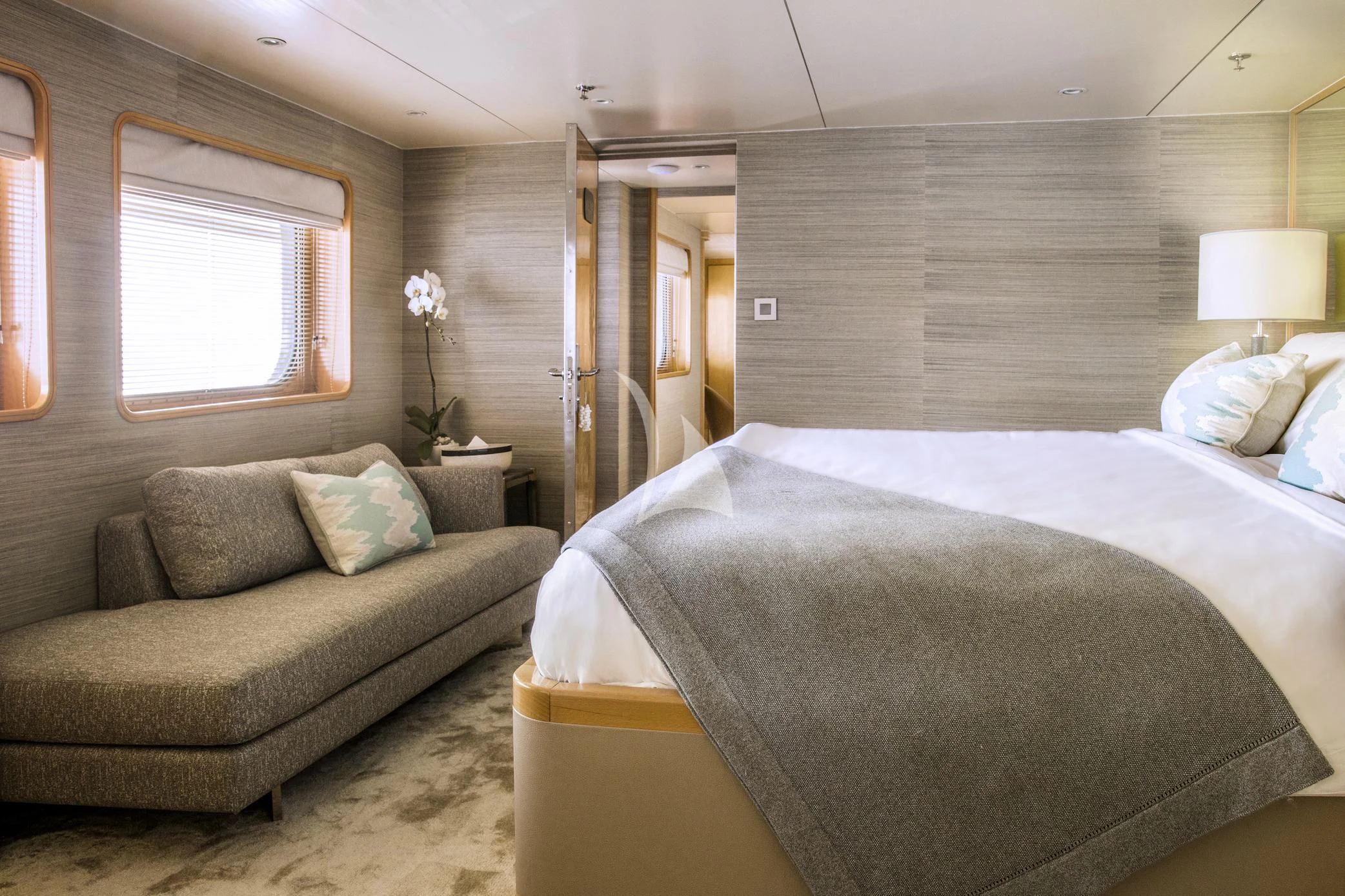 a bedroom with a bed and a window aboard AQUA BLU Yacht for Sale