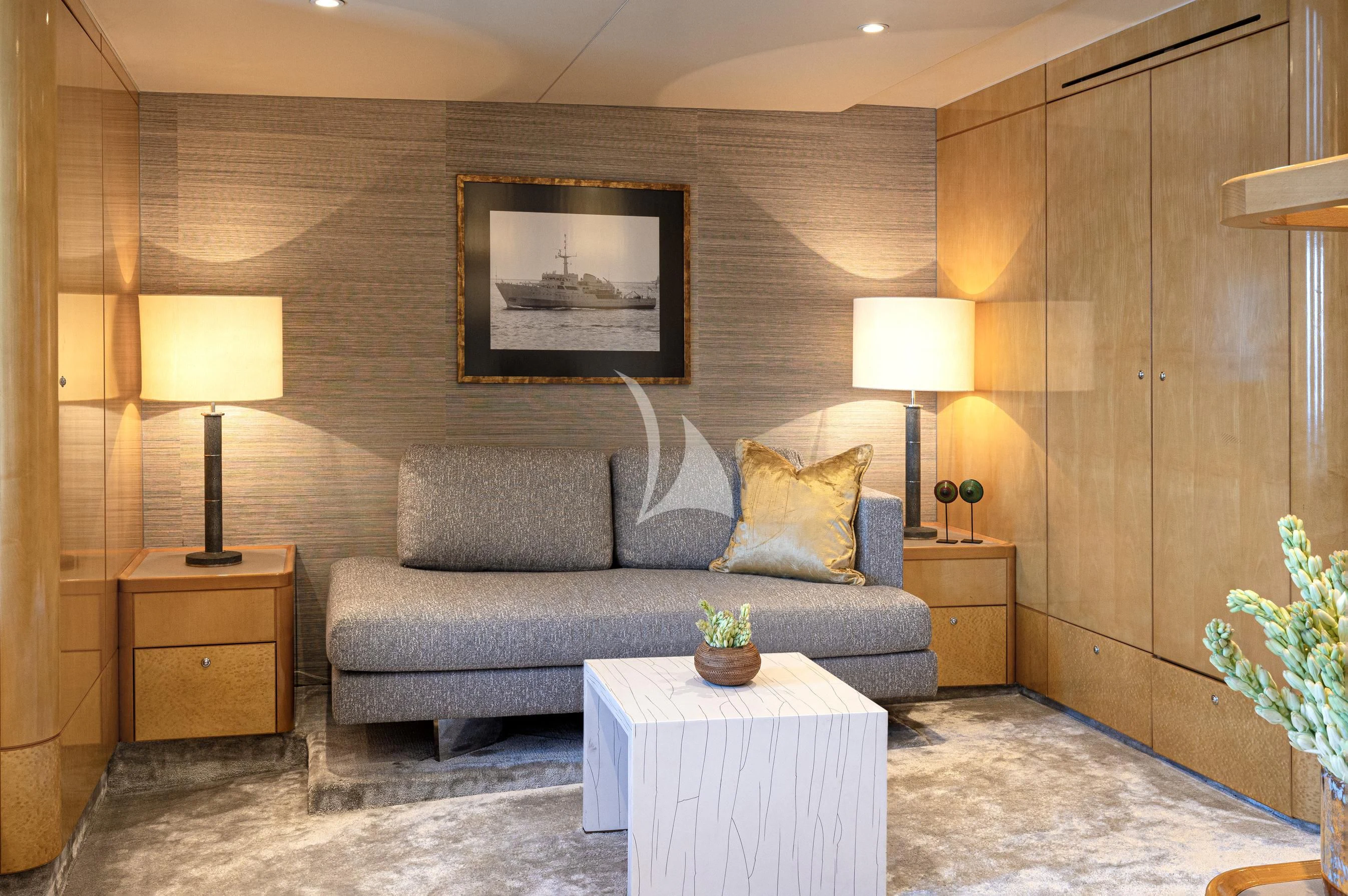 a living room with a couch and a coffee table aboard AQUA BLU Yacht for Sale