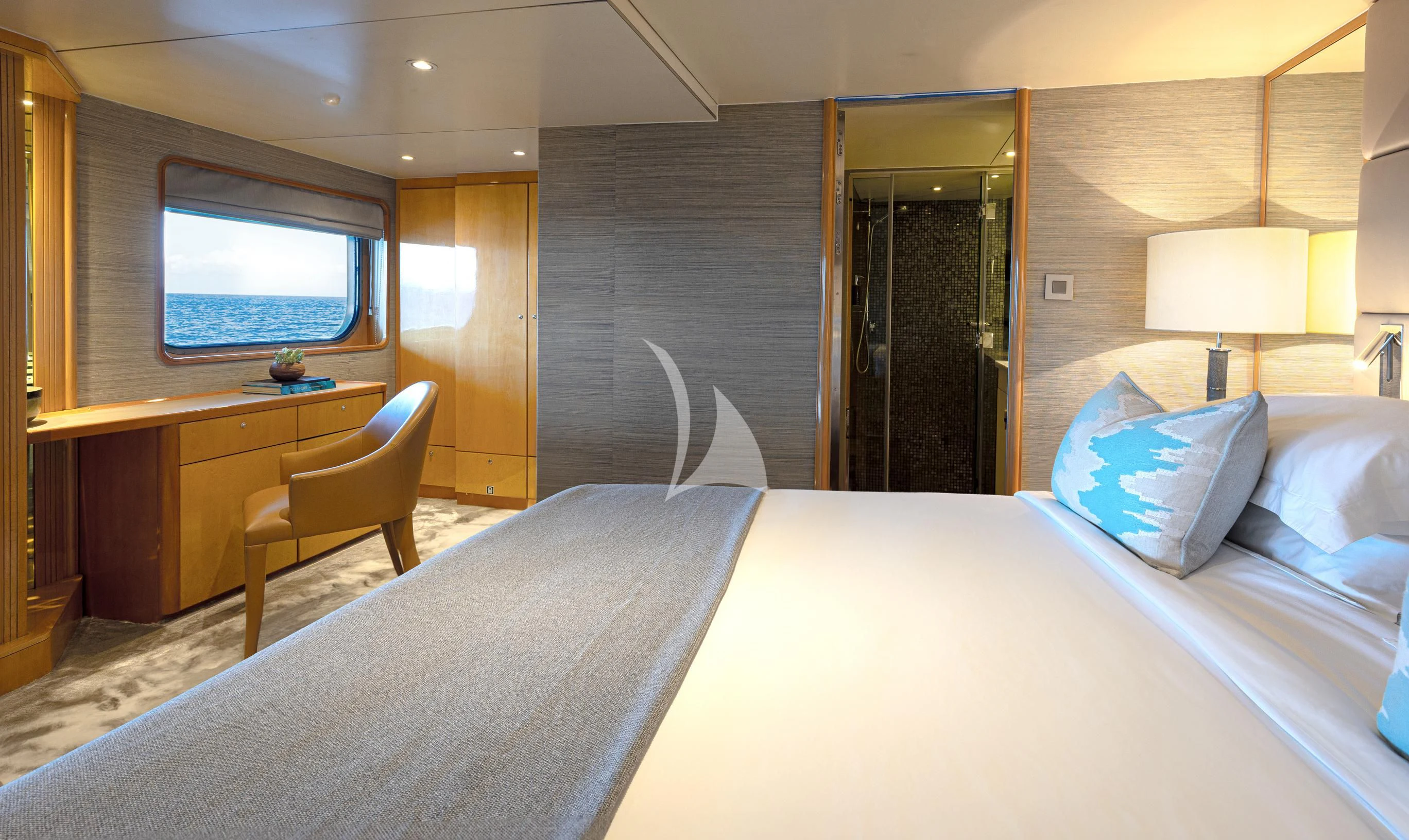 a hotel room with a bed and desk aboard AQUA BLU Yacht for Sale