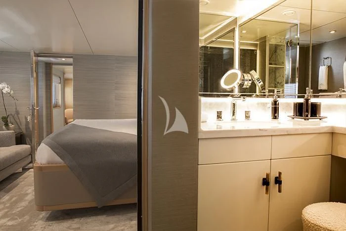 a bathroom with a bed and a mirror aboard AQUA BLU Yacht for Sale