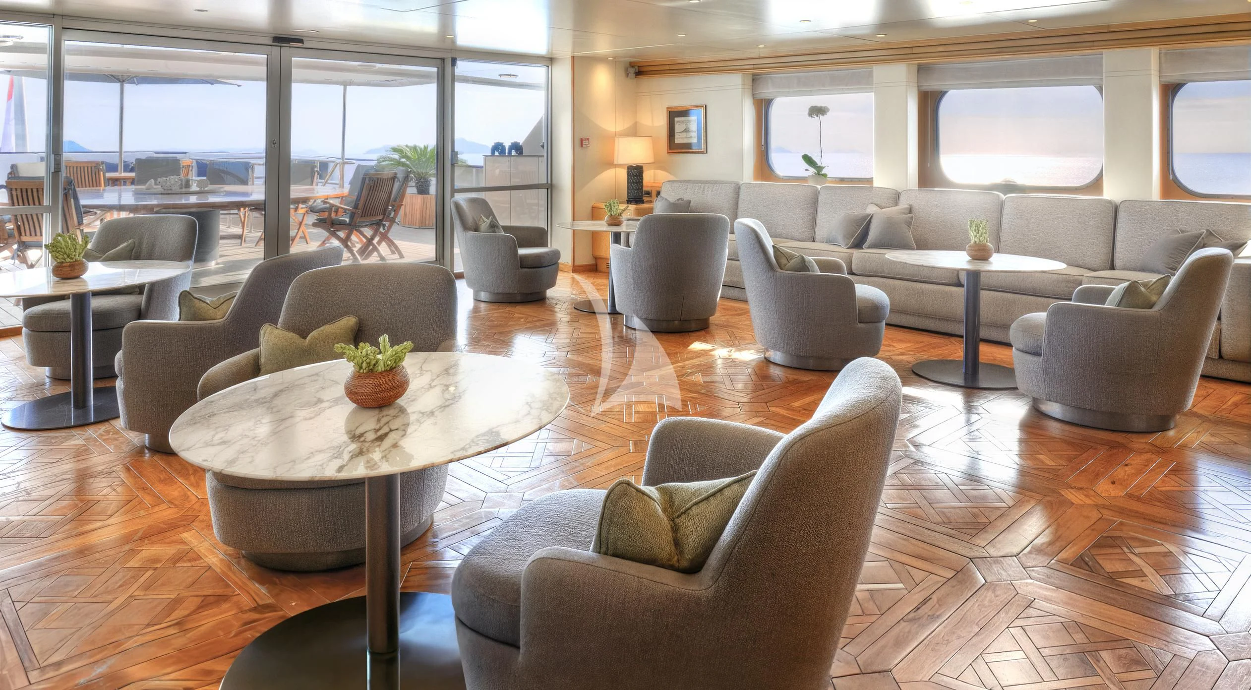 a living room with a table and chairs aboard AQUA BLU Yacht for Sale