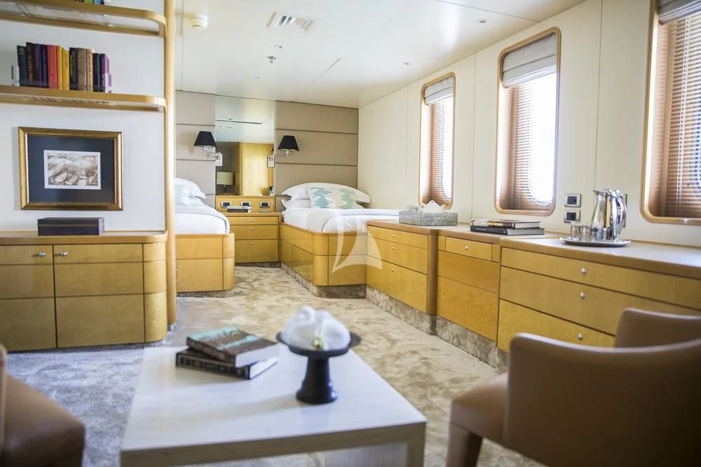 a room with a table and chairs aboard AQUA BLU Yacht for Sale